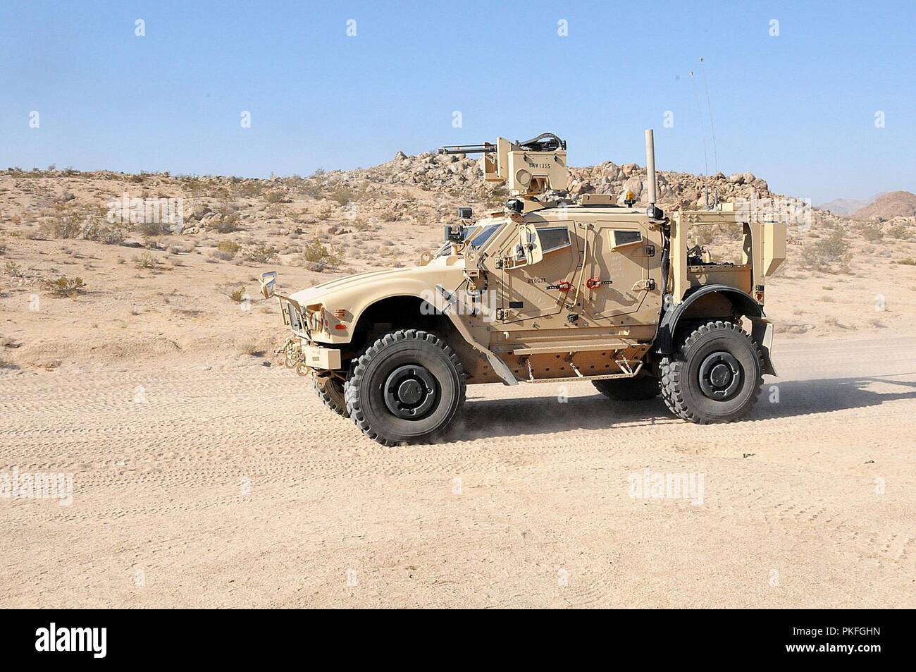 A mine resistant ambush protected vehicle drives en route during a convoy at the National Training Center at Fort Irwin, Calif., Aug. 7, 2018. The MRAP is part of the 1067th Composite Truck Company, Pennsylvania Army National Guard, which fell underneath the 152nd Combat Sustainment Support Battalion, South Dakota Army National Guard. The primary missions were supply and support convoys to enhance logistics operations to support the warfighter on the battlefield. Stock Photo