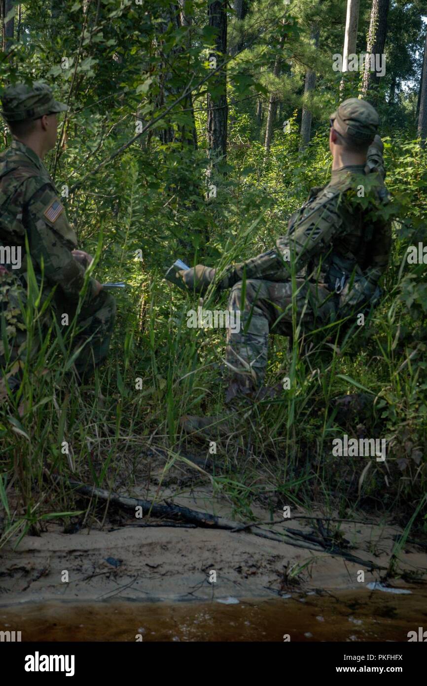 080918-A-UO598-010  Spc. Timothy Jordan of Alpha Troop,  6th Squadron, 8th Cavalry Regiment, 2nd Armored Brigade Combat Team, teaches Pvt. Austin Lawler how to navigate their terrain after finding their first grid point, August 9, at Fort Stewart, Ga. Stock Photo