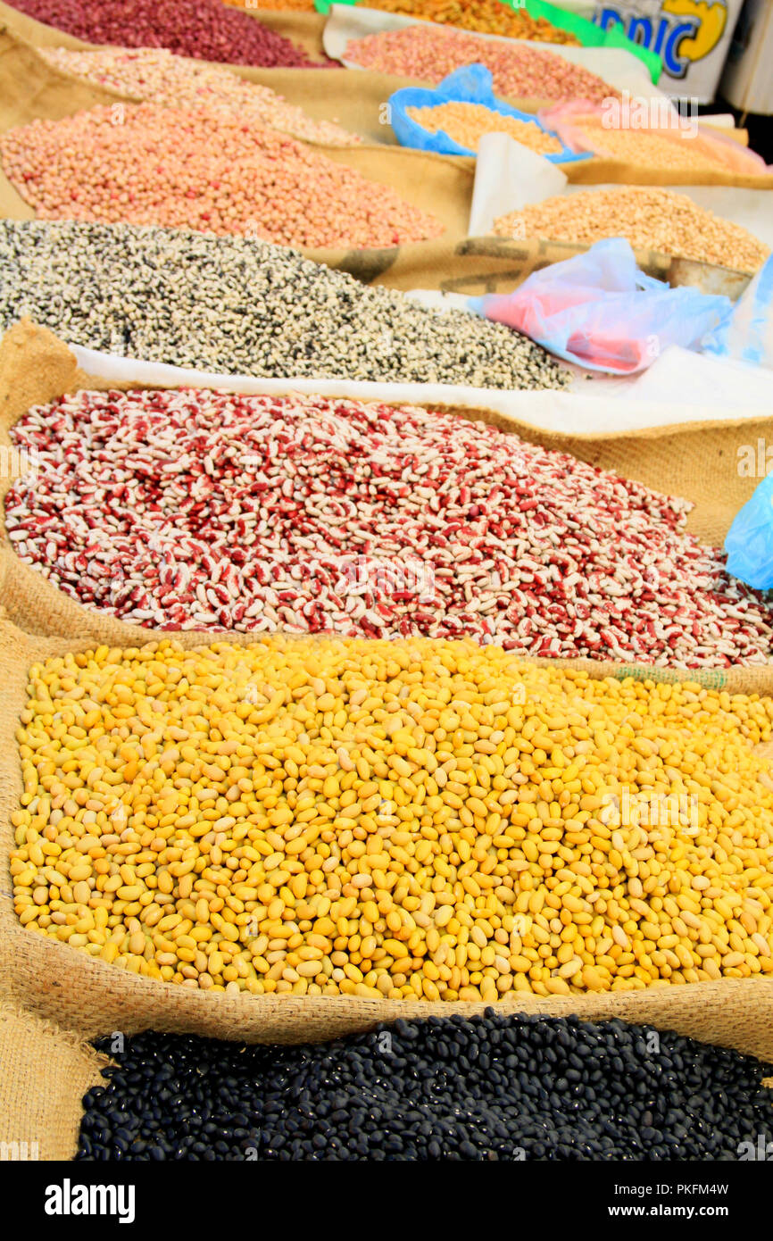 Pulses and Beans Displayed on Burlap Bags on Mexican market Stall Stock Photo