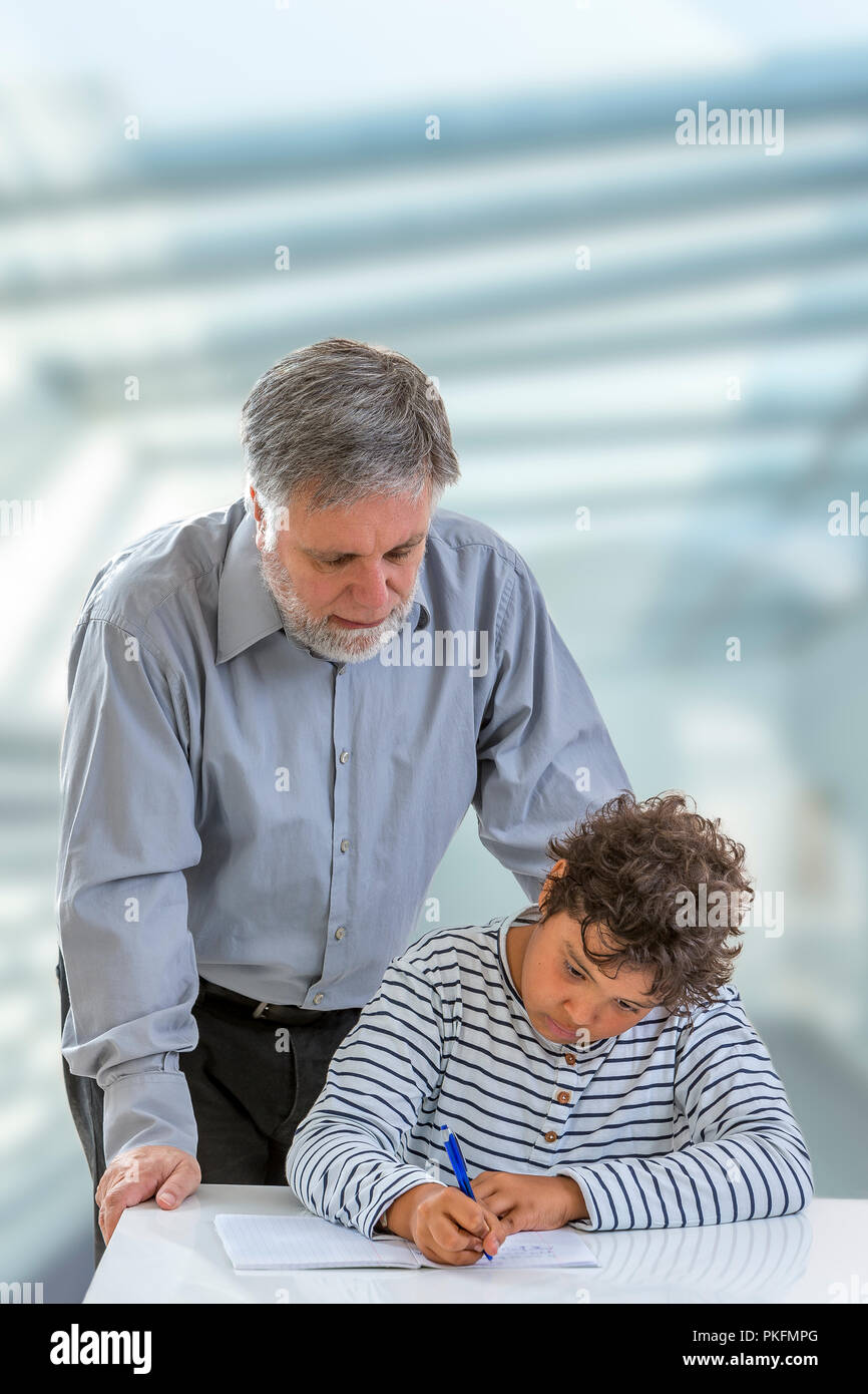 teen boy medical examination.little boy having his throat examined by health professional Stock Photo