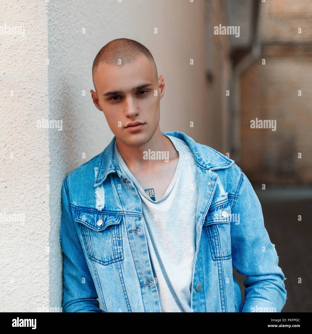 Handsome American model of a man in jeans clothes on the street Stock ...