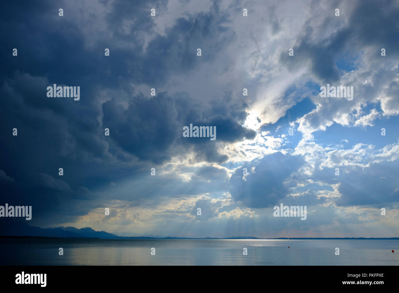 Storm clouds, dark clouds over the lake, Chieming am Chiemsee, with Chiemgau Alps, Bavaria, Germany Stock Photo