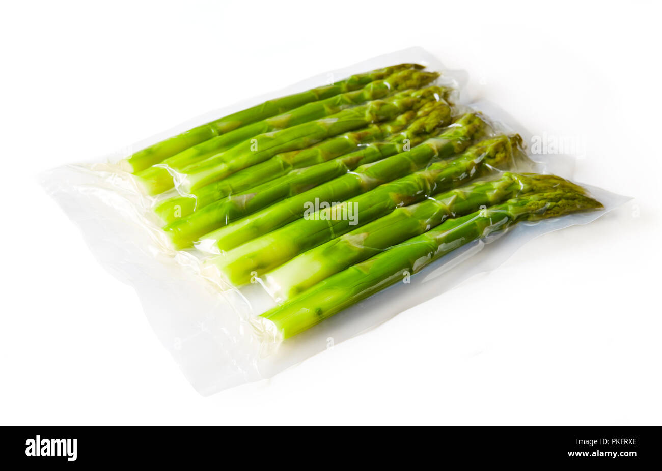 Fresh asparagus vacuum sealed rady for sous vide cooking, isolated on