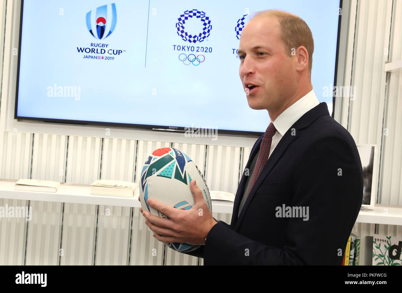 Duke of Cambridge holds an official rugby ball for the Rugby World Cup ...