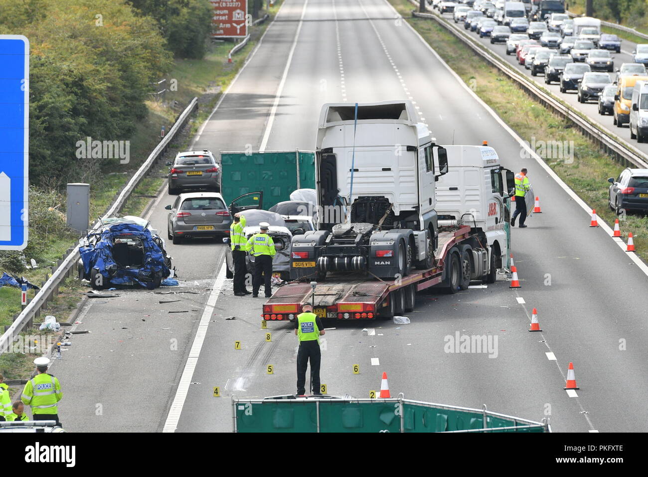 Emergency services at the scene of an accident on the M5 motorway near Taunton in Somerset. The road was closed following a collision this morning between a lorry and several cars in which two people died. Stock Photo