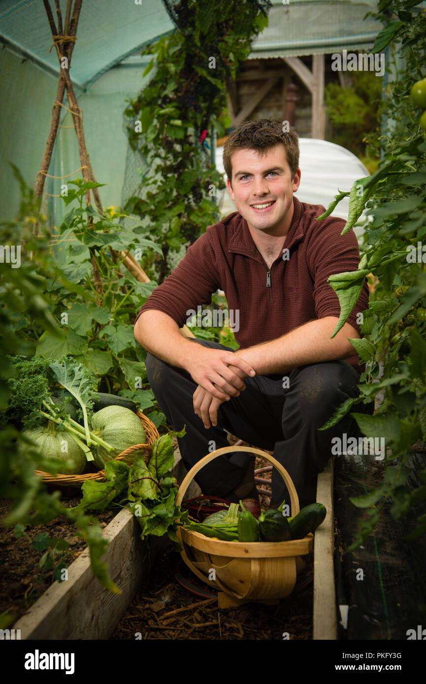 Huw Richards , young welsh celebrity video blogger and campaigning organic vegetable grower, in his kitchen garden at Tregaron, Wales UK Stock Photo