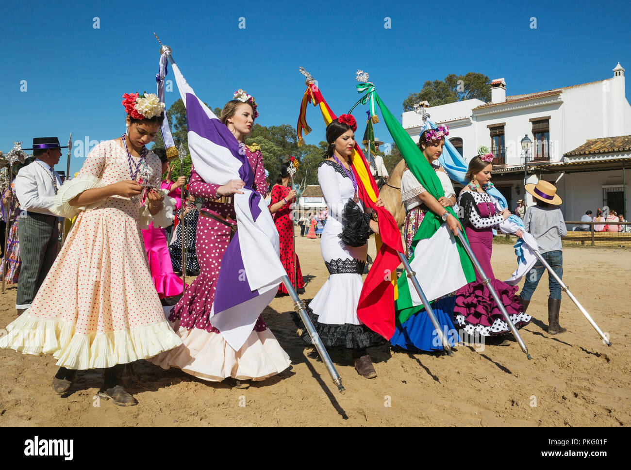 Young women wearing colourful gypsy dresses, Pentecost pilgrimage of El Rocio, Huelva province, Andalusia, Spain Stock Photo