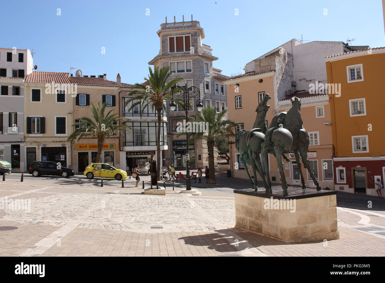 Spain. Balearic Islands. Menorca. Mahón. View of Plaça del Carme with horses bronze statue. Stock Photo