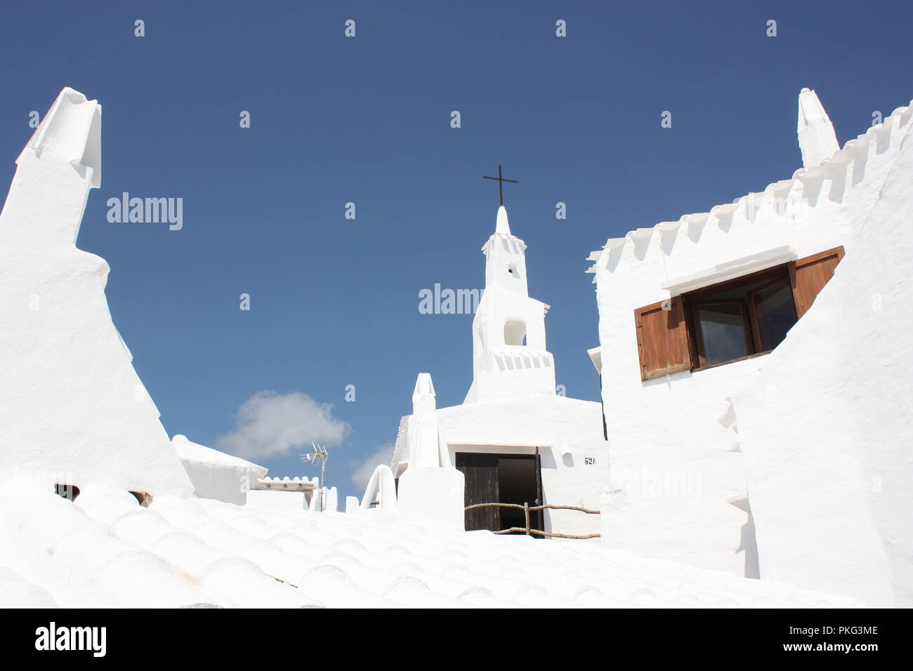 Spain. Balearic Islands. Menorca. Binebeca. Binebequer - Vell. Whitewashed church and houses. Stock Photo
