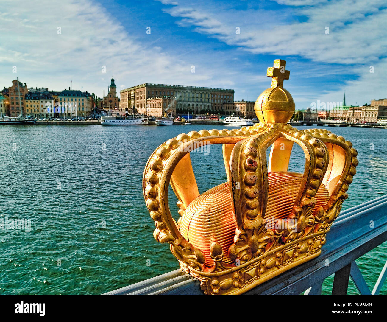 A shining royal crown with the  swedish castel in the background Stock Photo