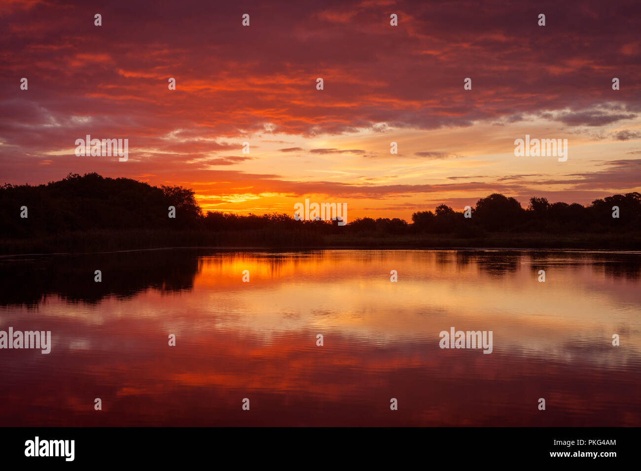 Barton-upon-Humber. 13th Sep 2018. UK Weather: A beautiful sunrise over the Lincolnshire Wildlife Trust's 'Far Ings National Nature Reserve' at Barton-upon-Humber, North Lincolnshire, UK. 13th September 2018. Credit: LEE BEEL/Alamy Live News Stock Photo