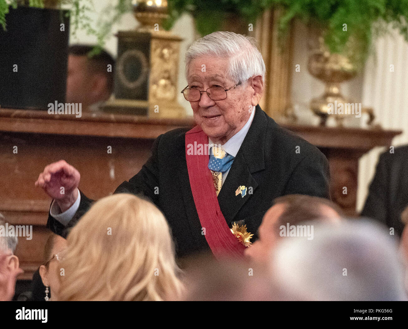 Then-Staff Sergeant Hiroshi Miyamura, United States Army, a Medal of Honor recipient for bravery in the Korean War, stands after being introduced by US President Donald J. Trump as he makes remarks at the Congressional Medal of Honor Society Reception in the East Room of the White House in Washington, DC on Wednesday, September 12, 2018. Credit: Ron Sachs/CNP /MediaPunch Stock Photo