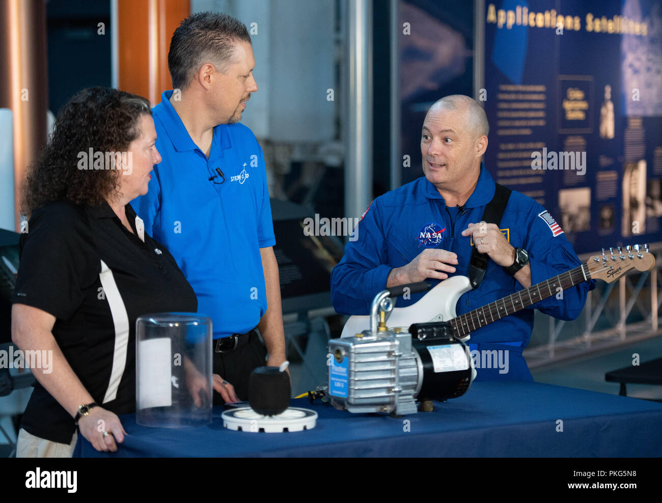 Chantilly, VA, USA. 12th Sep, 2018. NASA astronaut Scott Tingle helps conduct an experiment about sound waves in a vacuum during a taping of STEM in 30 with Beth Wilson and Marty Kelsey, Wednesday, Sept. 12, 2018 at the Smithsonian National Air and Space Museum's Steven F. Udvar-Hazy Center in Chantilly, Va. Tingle spent 168 days onboard the International Space Station as part of Expeditions 54 and 55. Photo Credit: (NASA/Joel Kowsky) Wednesday, Sept. 12, 2018 at the Smithsonian National Air and Space Museum's Steven F. Udvar-Hazy Center in Chantilly, Va. Tingle spent 168 days onboard th Stock Photo