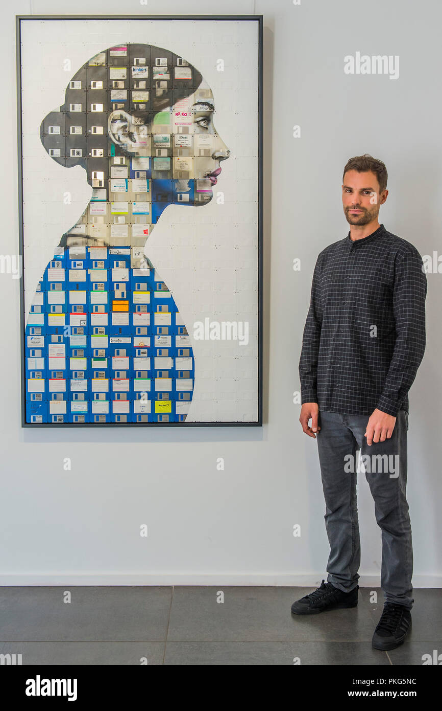 https://c8.alamy.com/comp/PKG5NC/london-uk-13th-september-2018-nick-gentry-with-profile-number-16-2018-human-connection-a-new-joint-exhibition-at-opera-gallery-featuring-work-by-artists-nick-gentry-uk-and-seo-young-deok-south-korea-both-artists-create-figurative-works-from-found-objects-nick-paints-portraits-on-top-of-obsolete-technological-materials-such-as-vhs-cassettes-and-floppy-disks-that-contain-peoples-memories-while-seo-renders-large-scale-hyper-realistic-sculptures-of-the-human-body-from-bicycle-chains-credit-guy-bellalamy-live-news-PKG5NC.jpg