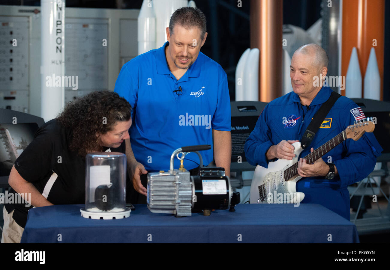 Chantilly, VA, USA. 12th Sep, 2018. NASA astronaut Scott Tingle helps conduct an experiment about sound waves in a vacuum during a taping of STEM in 30 with Beth Wilson and Marty Kelsey, Wednesday, Sept. 12, 2018 at the Smithsonian National Air and Space Museum's Steven F. Udvar-Hazy Center in Chantilly, Va. Tingle spent 168 days onboard the International Space Station as part of Expeditions 54 and 55. Photo Credit: (NASA/Joel Kowsky) Wednesday, Sept. 12, 2018 at the Smithsonian National Air and Space Museum's Steven F. Udvar-Hazy Center in Chantilly, Va. Tingle spent 168 days onboard th Stock Photo