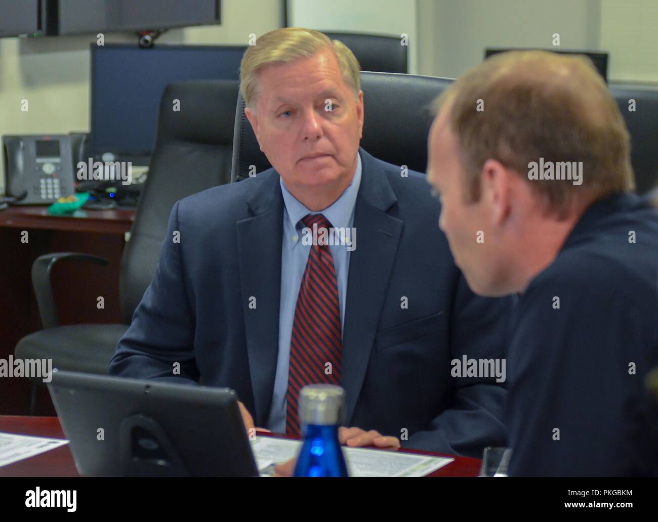 FEMA Administrator Brock Long, right, briefs U.S. Sen. Lindsey Graham of South Carolina to discuss the efforts of FEMA and federal partners in support of Hurricane Florence at the National Response Coordination Center September 13, 2018 in Washington, DC. Stock Photo