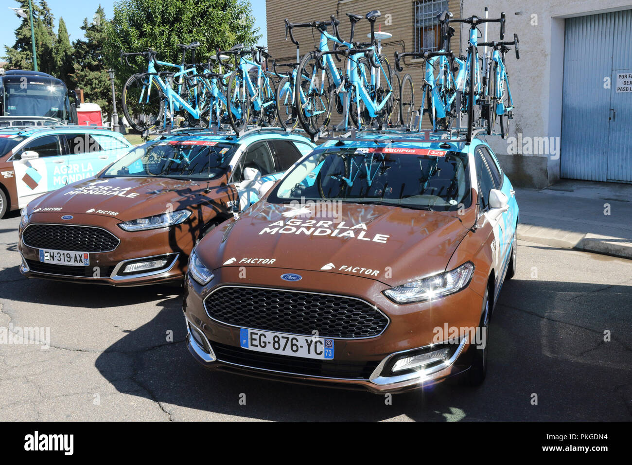 Ejea de los Caballeros, Spain. 13th Sep, 2018. The AG2R LA MONDIALE team cars parked at the start of the Vuelta, with bicycles on the baggage rack.. Isacco Coccato/Alamy Live News Stock Photo