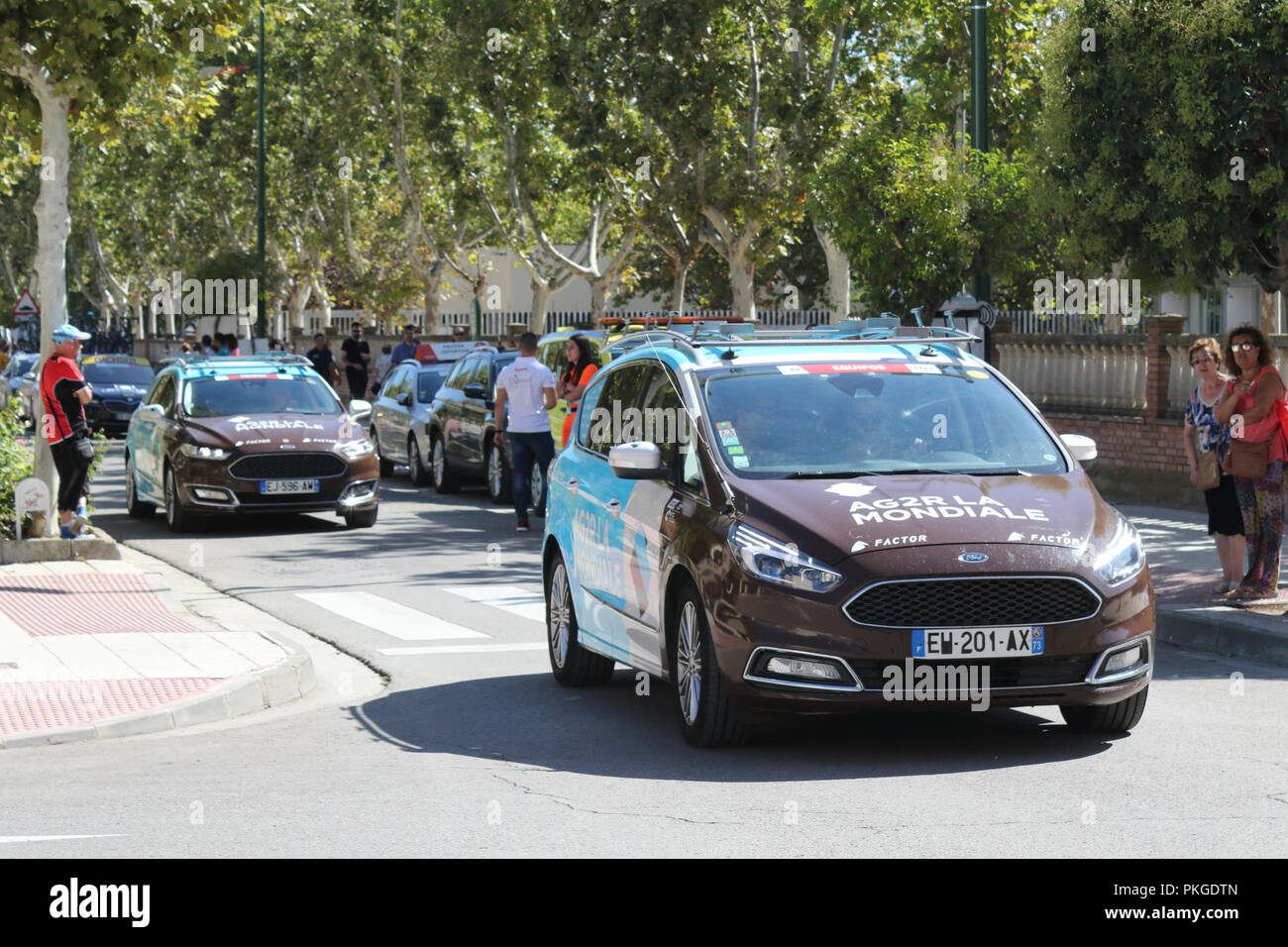 Ejea de los Caballeros, Spain. 13th Sep, 2018. The AG2R LA MONDIALE team cars moving on the road of the start of the Vuelta in a parade. Isacco Coccato/Alamy Live News Stock Photo