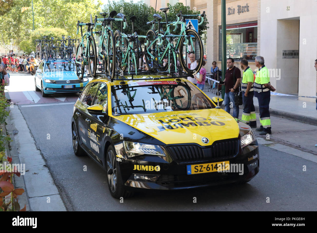 Ejea de los Caballeros, Spain. 13th Sep, 2018. The LOTTO SOUDAL team cars parked at the start of the Vuelta, with bicycles on the baggage rack.. Isacco Coccato/Alamy Live News Stock Photo