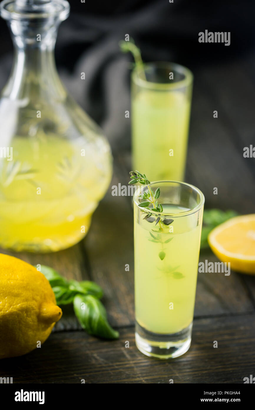 Traditional italian lemon liqueur limoncello and fresh citrus lemon ...