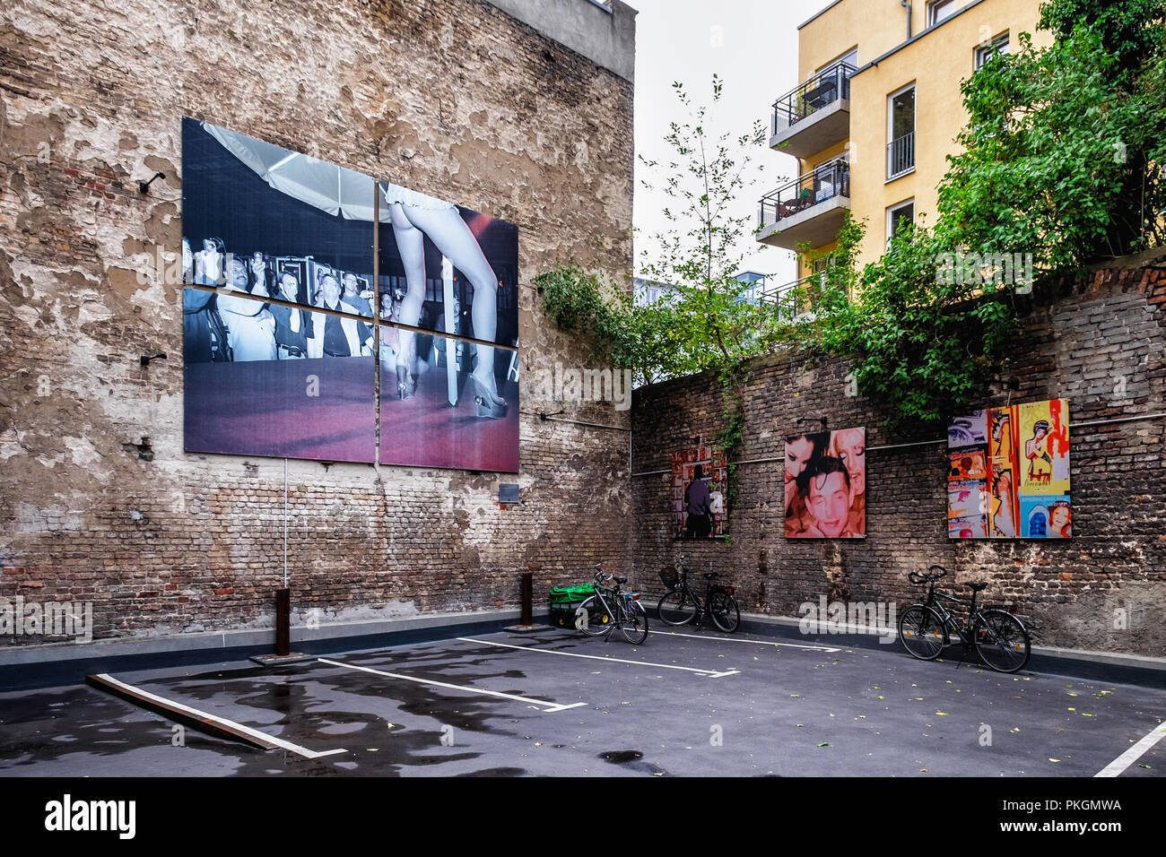 Berlin,Mitte,Torstrasse 109. Open-air gallery with exhibition of large photographic images by CAMERADOS in an inner courtyard of a building. Stock Photo