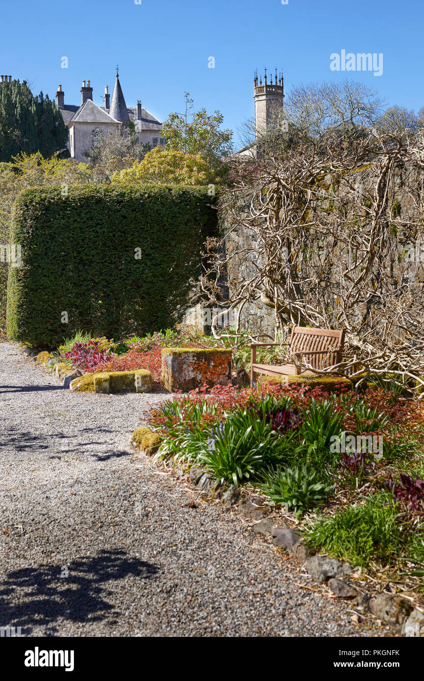 A peaceful, seating area in the garden of of Ardmaddy Castle. Argyll Stock Photo