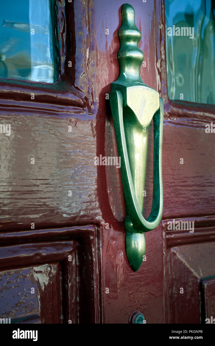 brass door knocker on wooden glazed vintage external door Stock Photo - Alamy