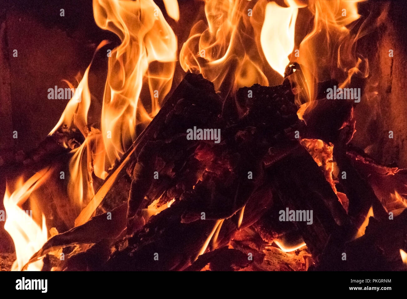 Fire flames, bonfire close up photo. Beautiful natural phenomen of dangerous burning wood Stock