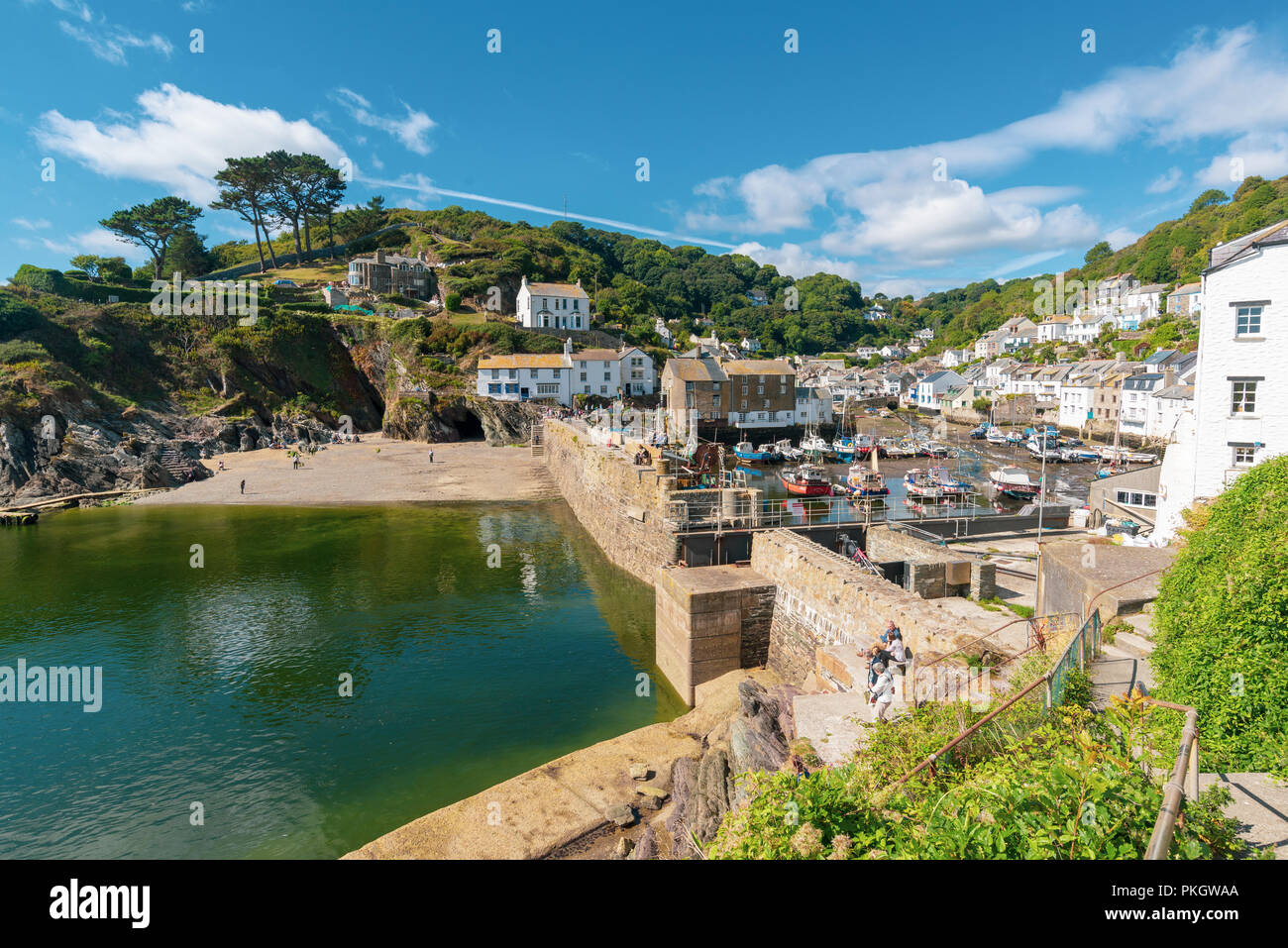 Turquoise sea and blue sky at Polperro, South Cornwall, England, UK Stock Photo