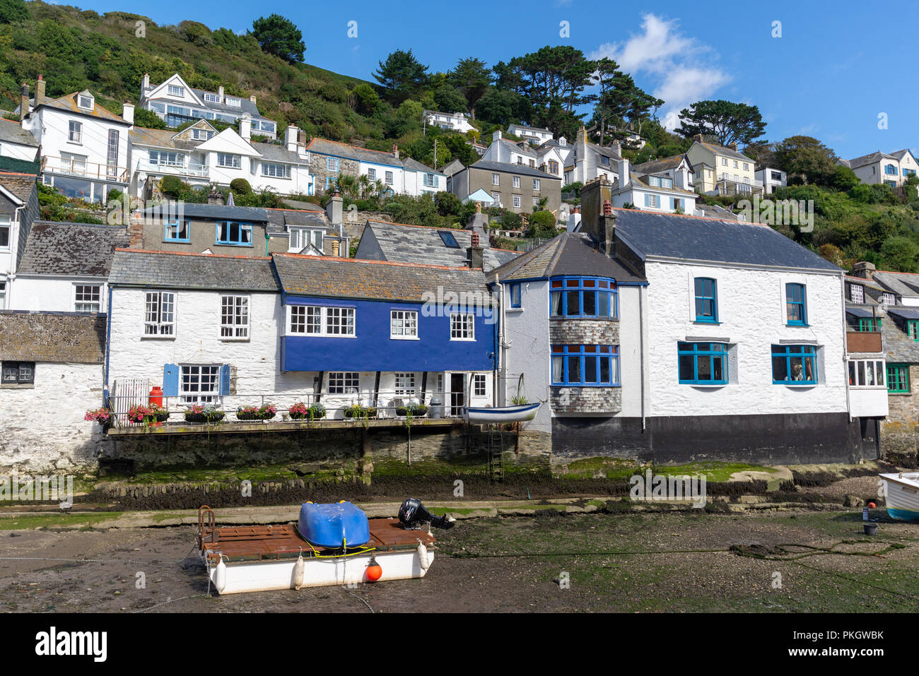 Blue and white buildings overlooking Polperro harbour, South Cornwall, England, UK Stock Photo