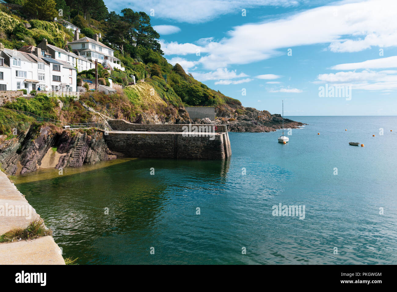 Turquoise sea and blue sky at Polperro, South Cornwall, England, UK Stock Photo