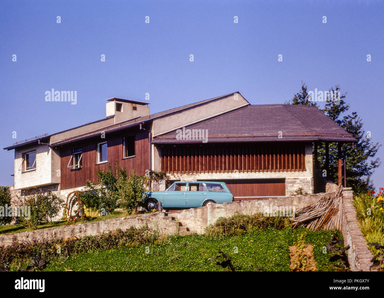 A house on the hillside in La Tour De Peilz, Vevey, Switzerland with a Hillman Minx Estate car outside. Taken in September 1971. Stock Photo