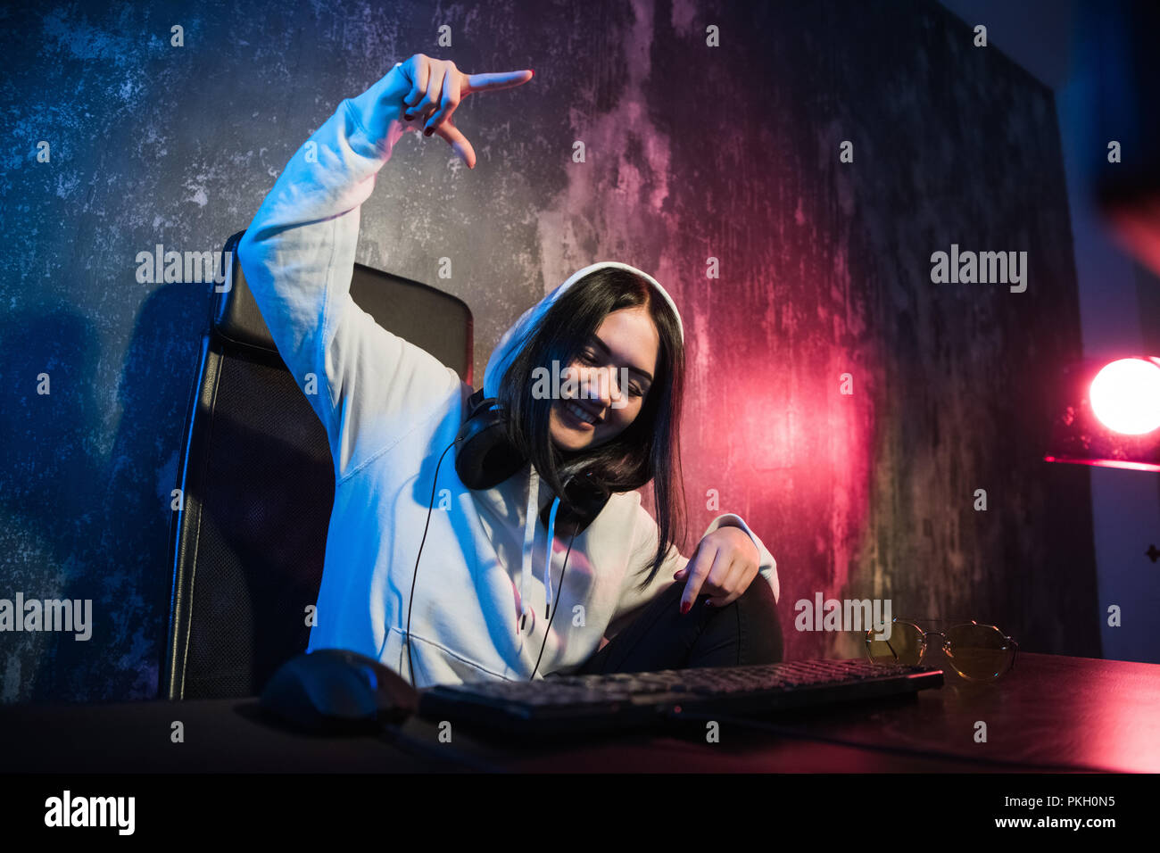 Woman hacker is ready to run malware program virus on the internet. Start hacking remote system computer Stock Photo