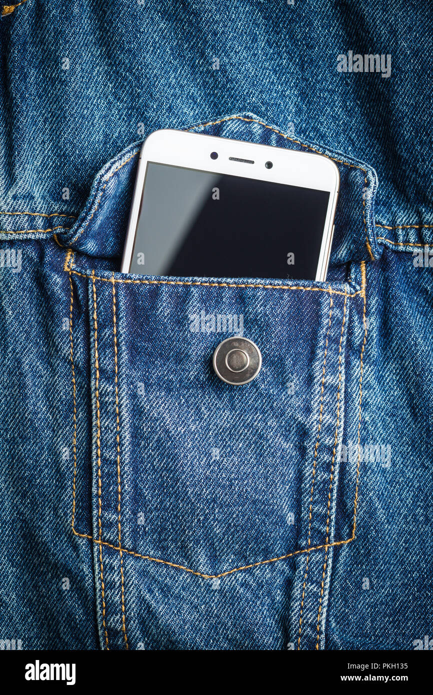 White smartphone in jeans jacket pocket Stock Photo - Alamy