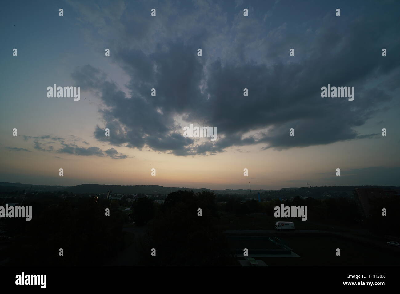 Beautiful sunset sky above clouds with dramatic light Stock Photo - Alamy