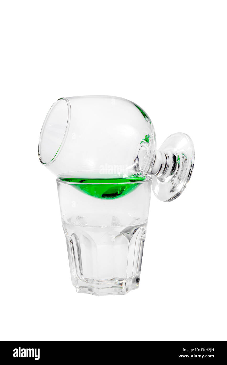Cocktail with absinthe and tonic, syrup, glass on the glass, on each ...