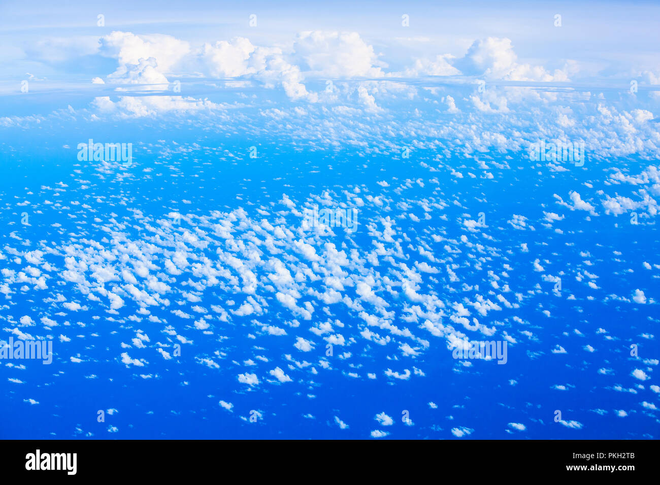 Aerial birds eye view above clouds of the blue sky Stock Photo - Alamy