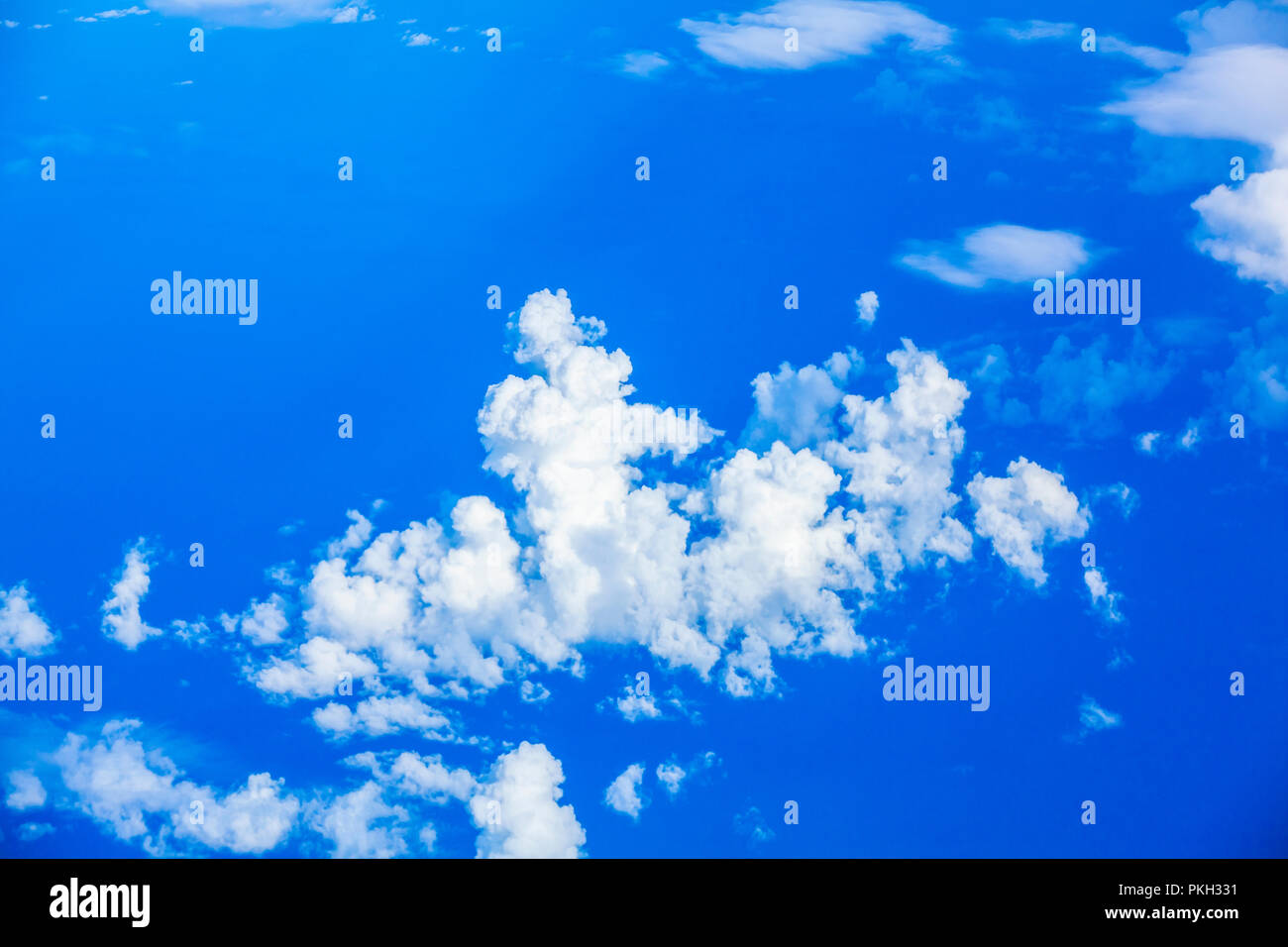 Aerial birds eye view above clouds of the blue sky Stock Photo - Alamy