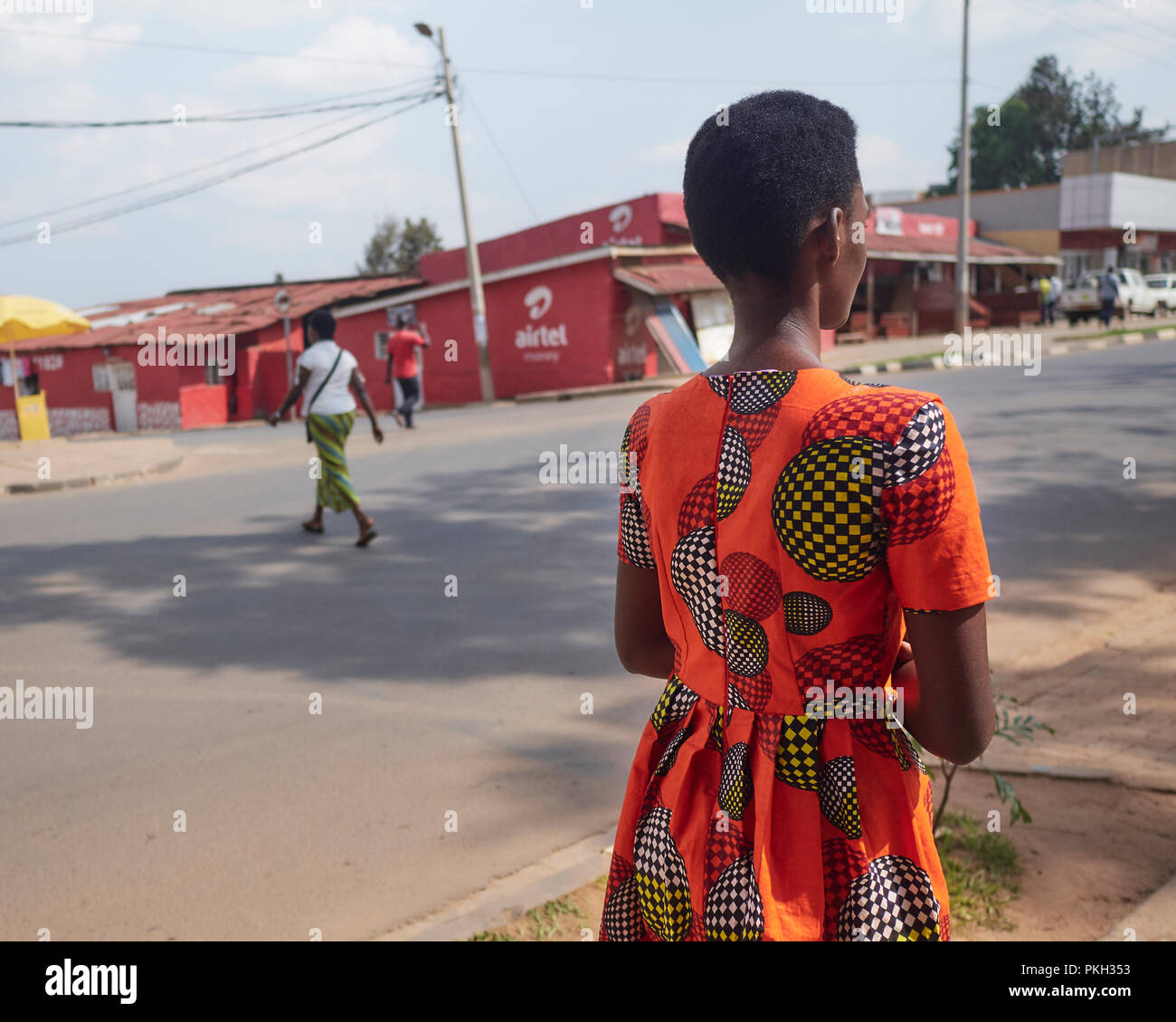 Lady wearing traditional dress in Kigali, Rwanda. Street photography Stock Photo