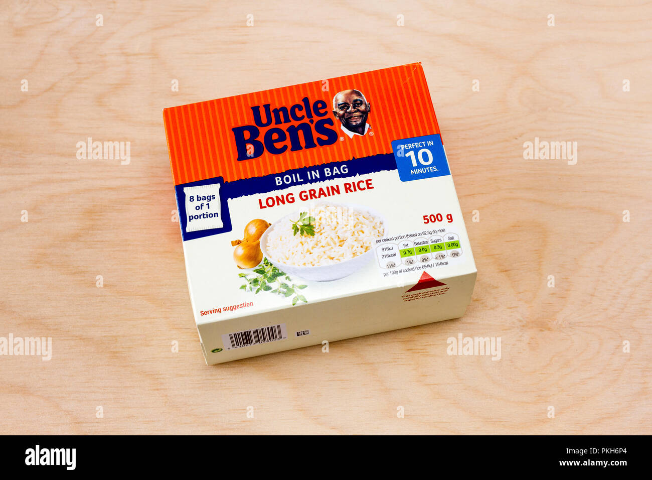 Box of Uncle Ben's boil in the bag long grain rice, on a light wood background, United Kingdom Stock Photo