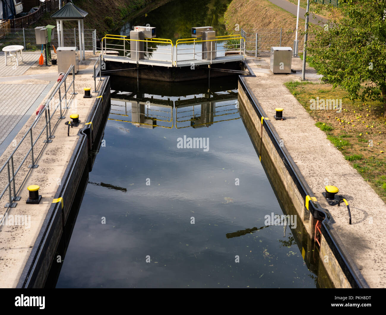 A closed water lock on a narrow channel in the woods. Stock Photo