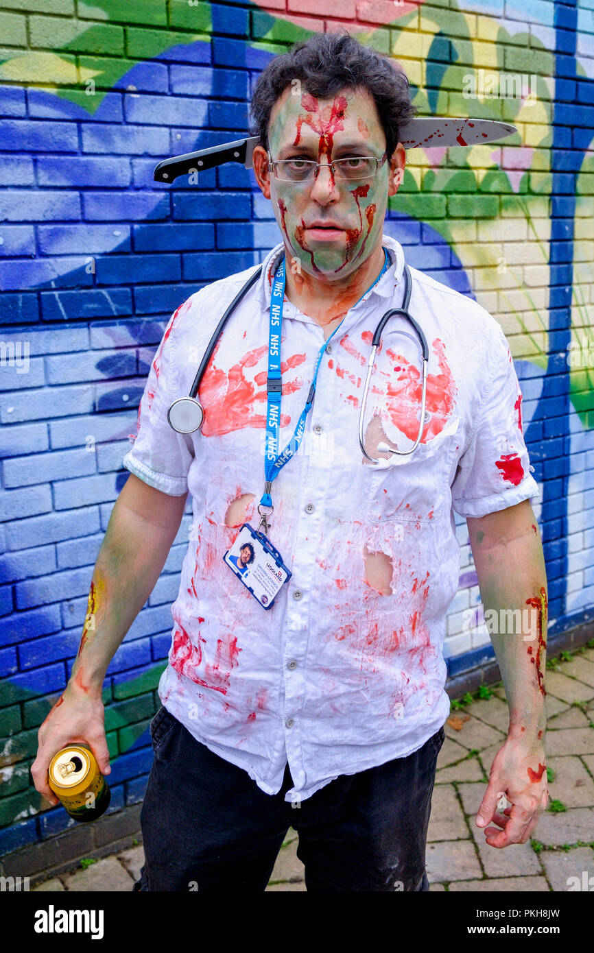 Bristol, UK. 28th Oct, 2017. A man dressed as a zombie is pictured as he takes part in in a zombie walk through the city centre. Stock Photo