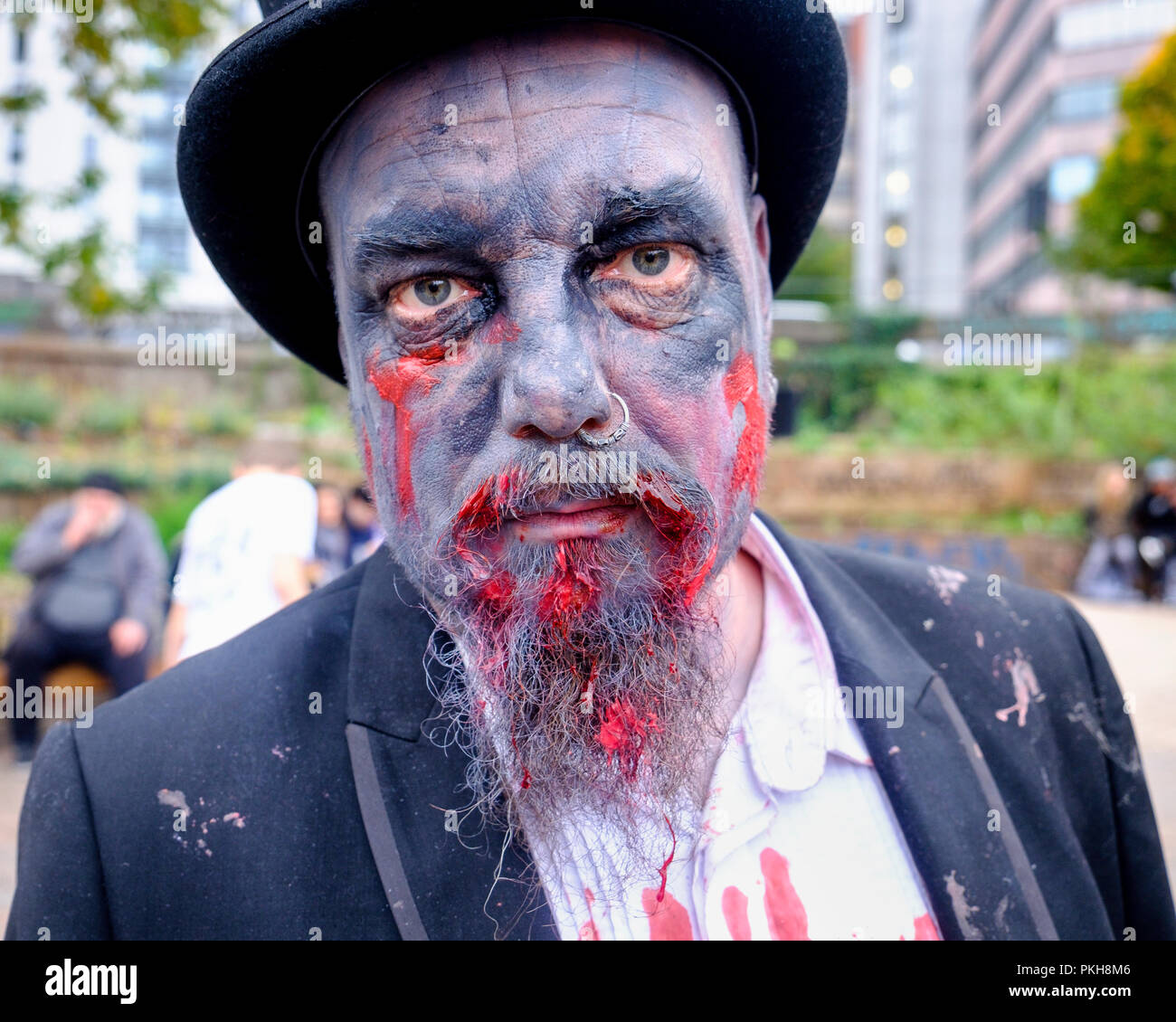 Bristol, UK. 28th Oct, 2017. A man dressed as a zombie is pictured as he takes part in in a zombie walk through the city centre. Stock Photo