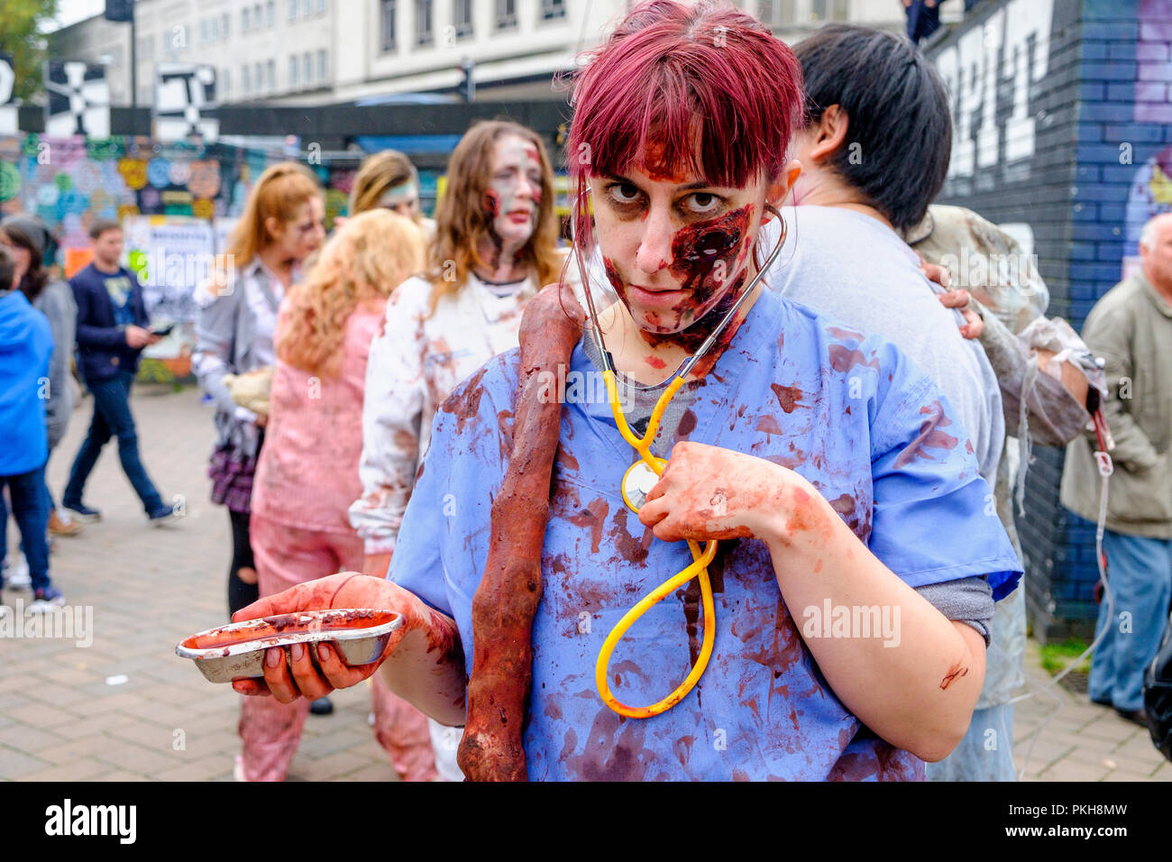 Bristol, UK. 28th Oct, 2017. A  woman dressed as a zombie nurse doctor is pictured as she takes part in a zombie walk through the city centre. Stock Photo