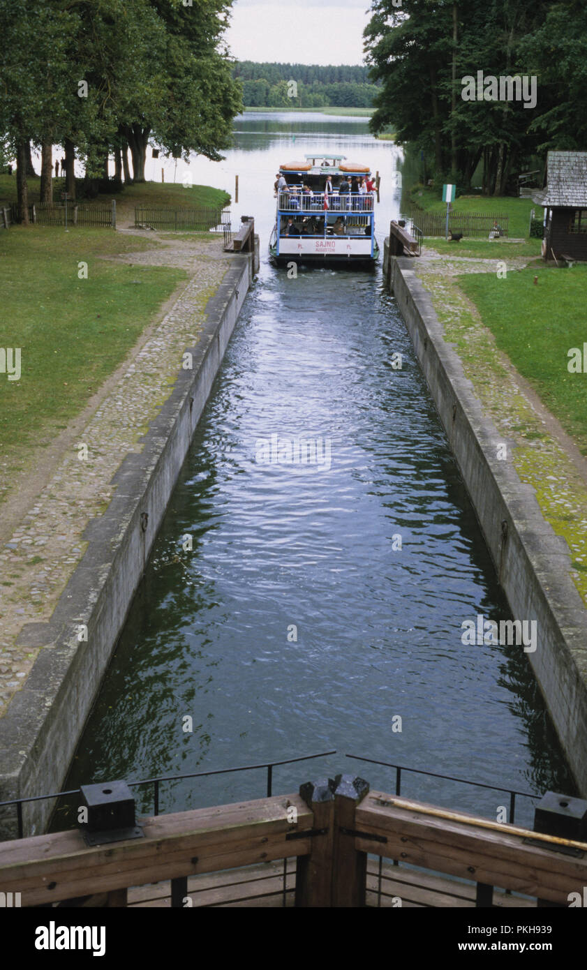 Ferry passing through canal lock in north east Poland August 2007 Stock Photo