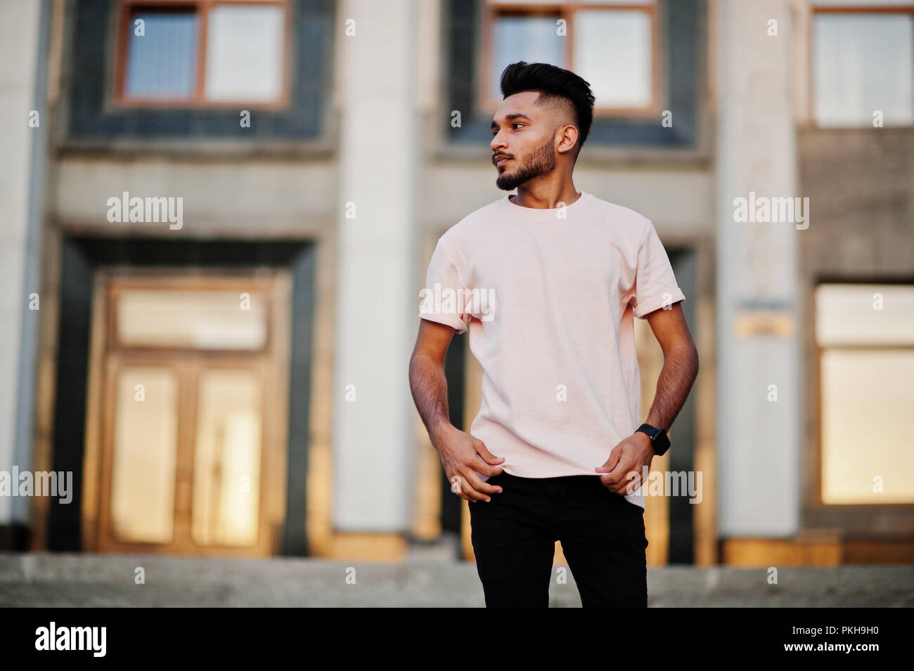 Stylish indian beard man at pink t 