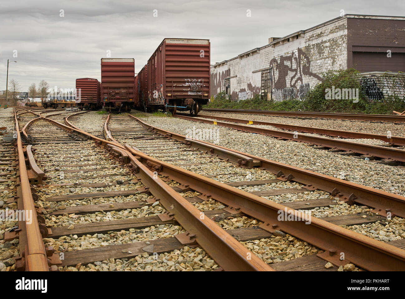 Urban Railroad Tracks and Cars. Railroad tracks running through an