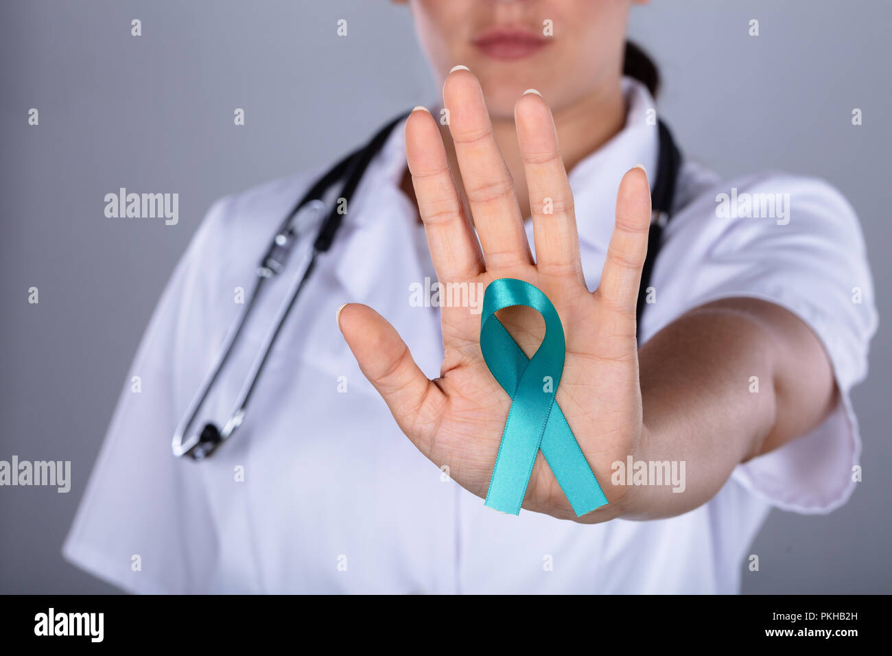 Close-up Of A Female Doctor's Hand Raising Awareness On Ovarian Cancer Stock Photo