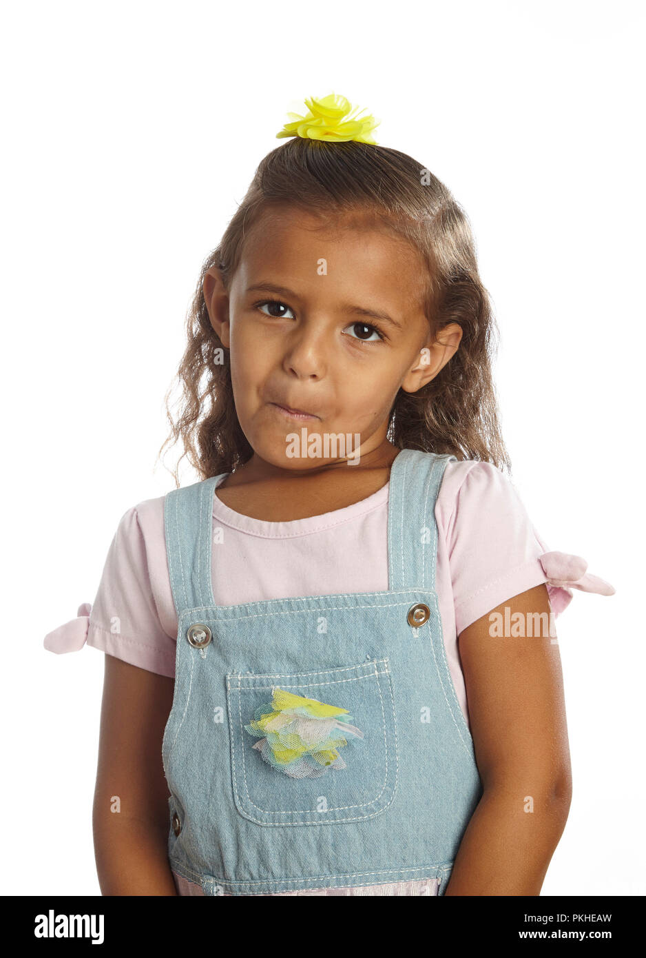 little girl in overalls Stock Photo Alamy