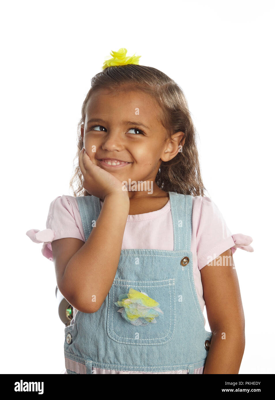 little girl in overalls Stock Photo